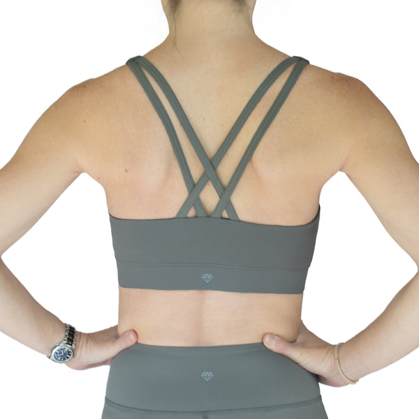 Fit For Barre Rainbow Sports Bra in grey, accented with double straps in the back and rainbow design in the front.