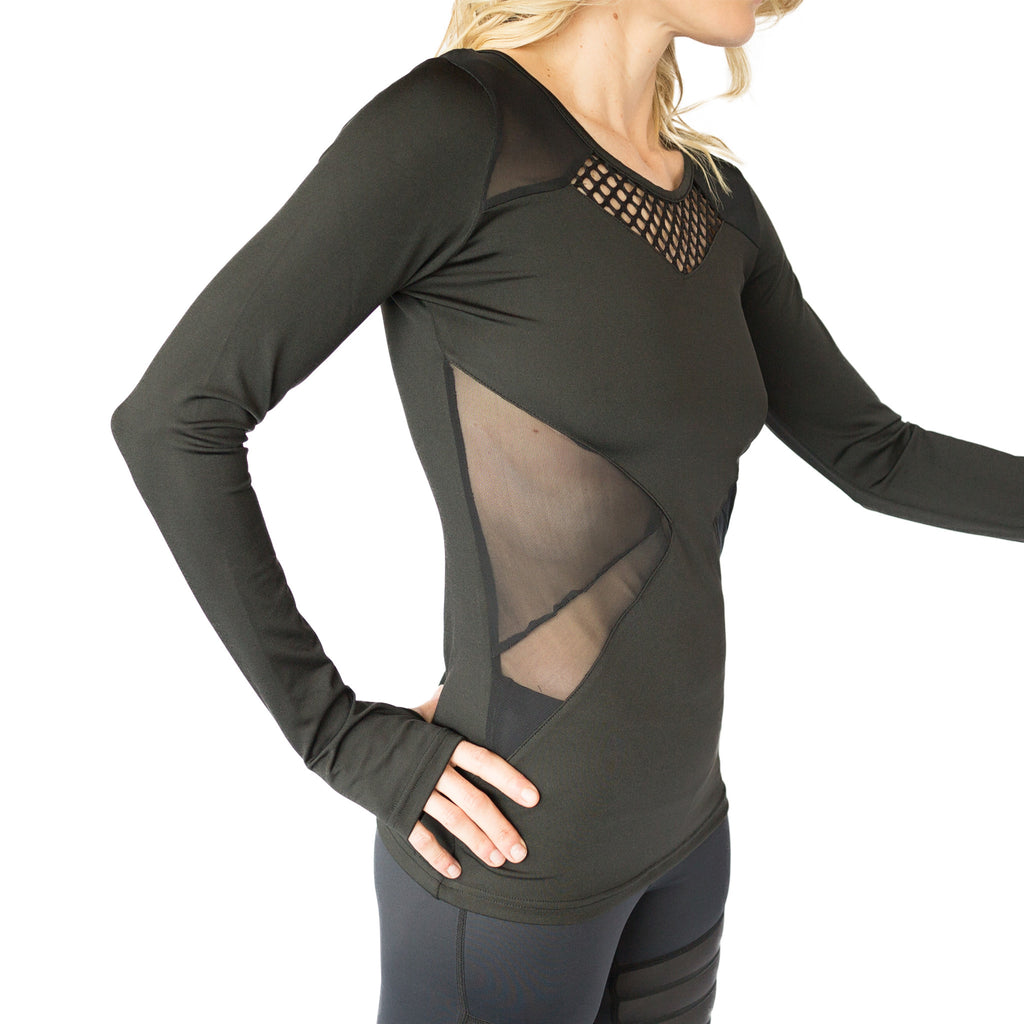 Fit For Barre Mesh Cut Out Top in a fitted black long sleeve style, accented with mesh and thumbholes.