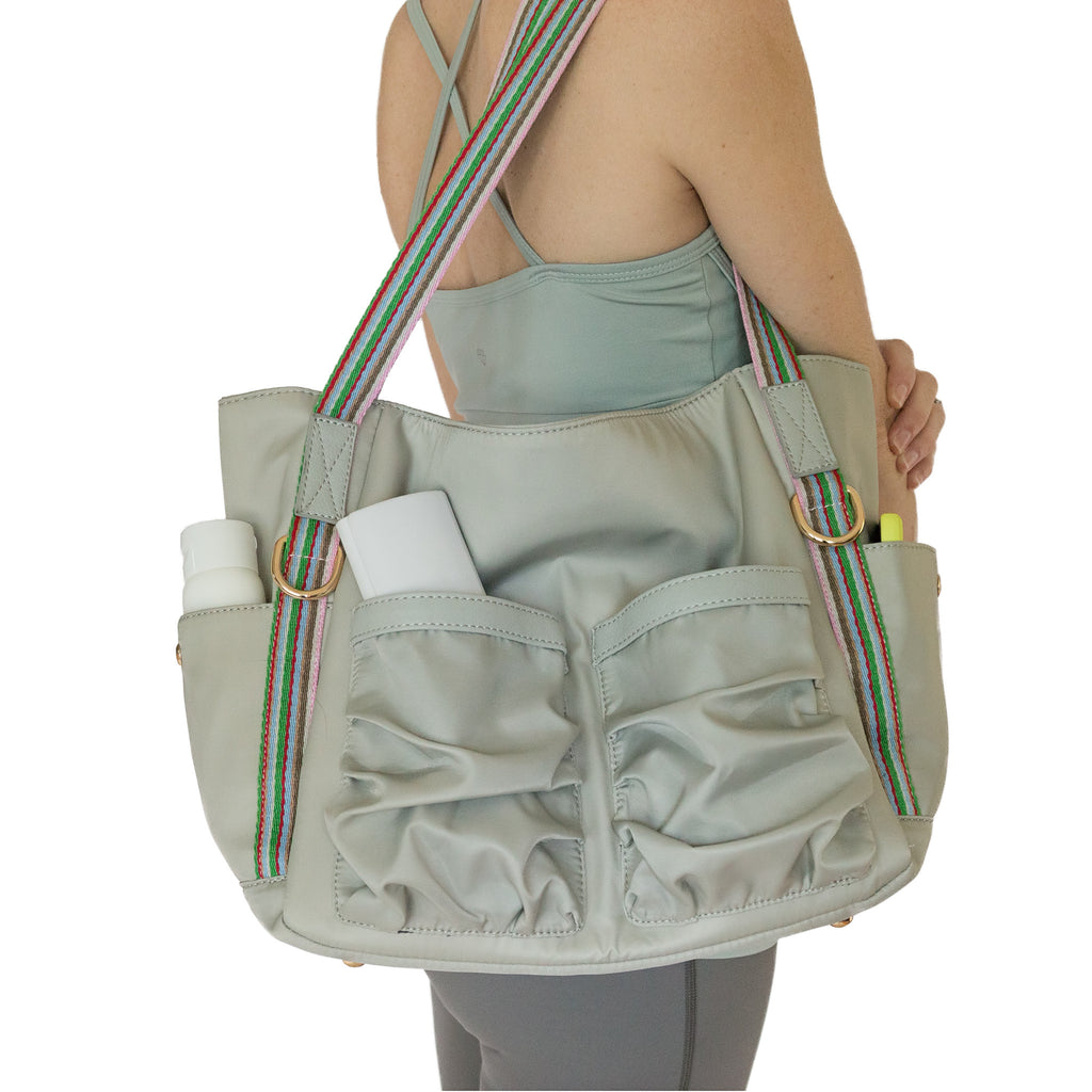 Fit For Barre Studio Tote in grey nylon fabric with colorful canvas straps and lots of pockets.